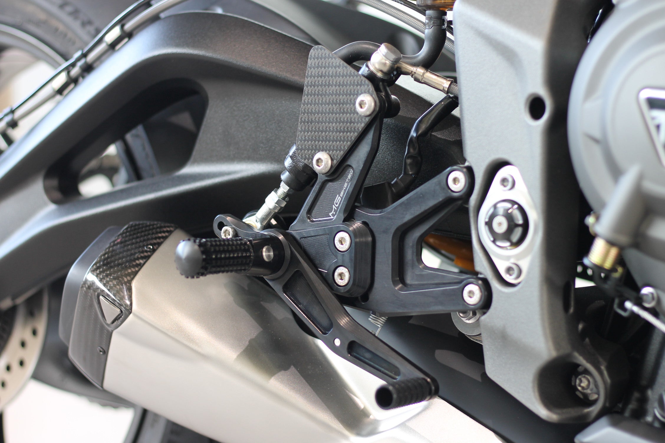MG Biketec footrest system with ABE for Triumph Street Triple 765 RS / Moto2 2017 - 2022