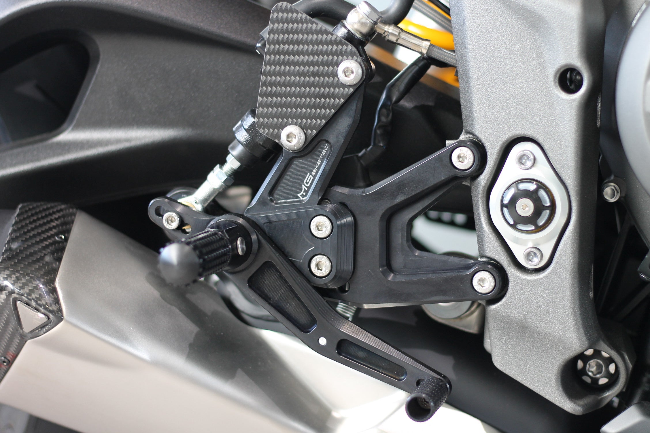 MG Biketec footrest system with ABE for Triumph Street Triple 765 RS / Moto2 2017 - 2022